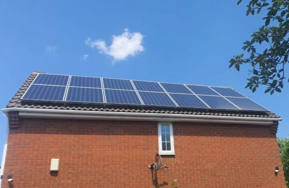 Solar panels spanning one side of a roof
